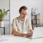 Freelancer Man Working On Laptop for earning money
