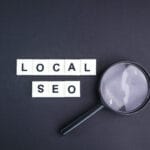 magnifying glass with local seo alphabet words.