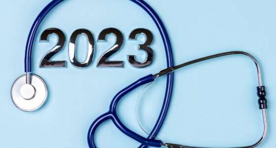 2023 health medical insurance. 2023 New Year background with stethoscope on blue